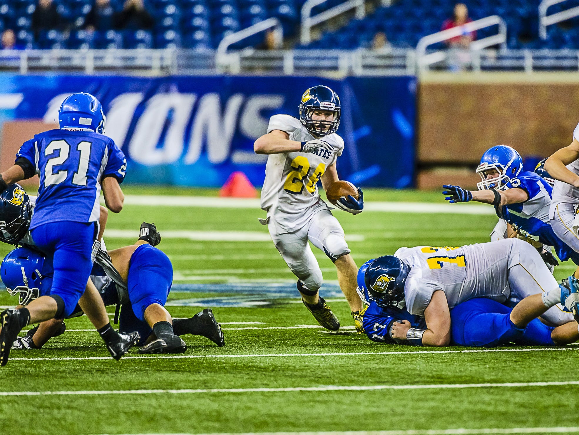 Jared Smith, of Pewamo-Westphalia, cuts back to a hole in the Ishpeming line late in the state high school football title game last season. He ended the season with 3,250 rushing yards, a new state record. Smith is one of nine returning players on offense and defense for the Pirates.