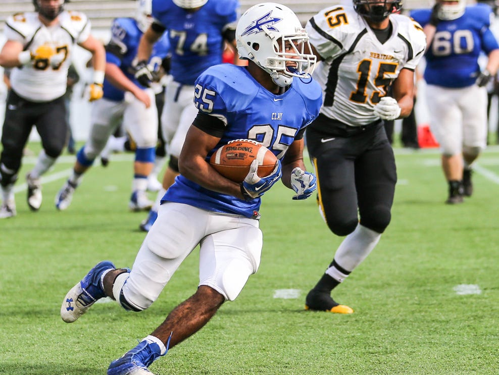 Clay's Bilal Ally runs the ball as a sophomore during the 5A championship game. Ally has rushed for 2,727 yards and 35 touchdowns as a senior after missing his junior year with an ACL injury.
