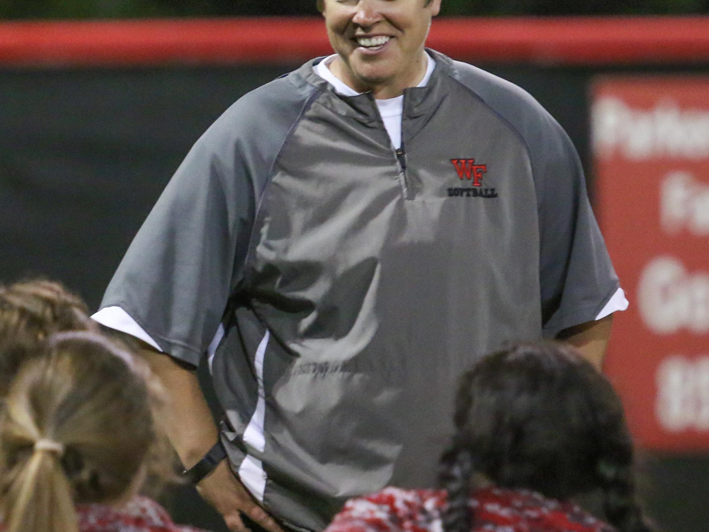 West Florida Head Coach Jessica Smith gives her team an upbeat chat after her last game with the school Wednesday night following the Region 1-6A quarterfinal game against Mosley at West Florida High School.