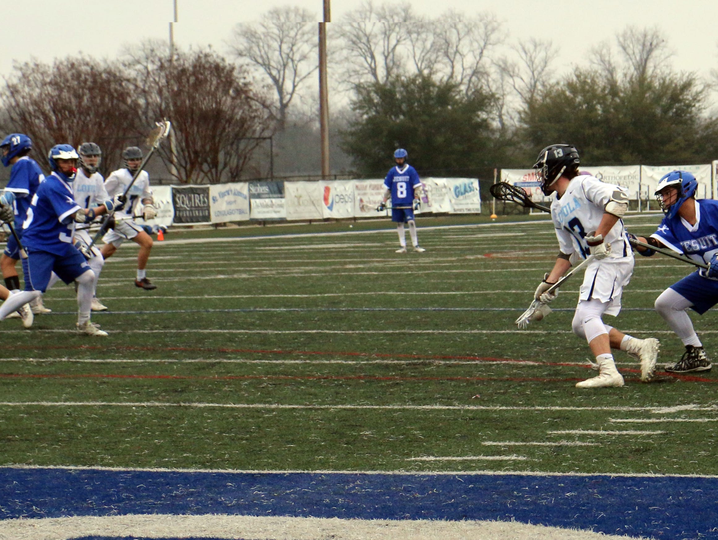 Loyola's Thomas Wiener attacks the Jesuit goal during Sunday's action at Messmer Stadium.