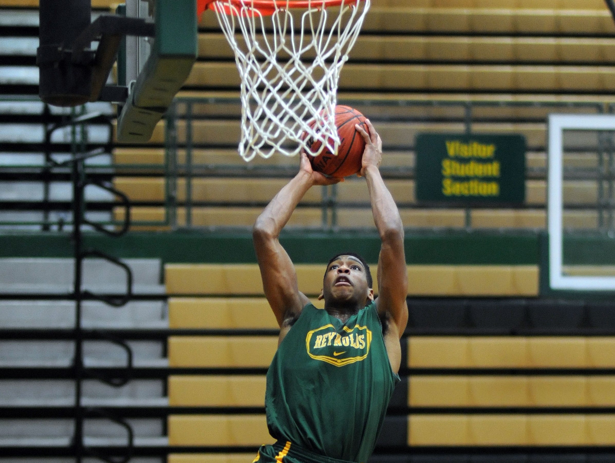 Recent Reynolds graduate JaQuann Lockhart has signed to play college basketball for Warren Wilson.