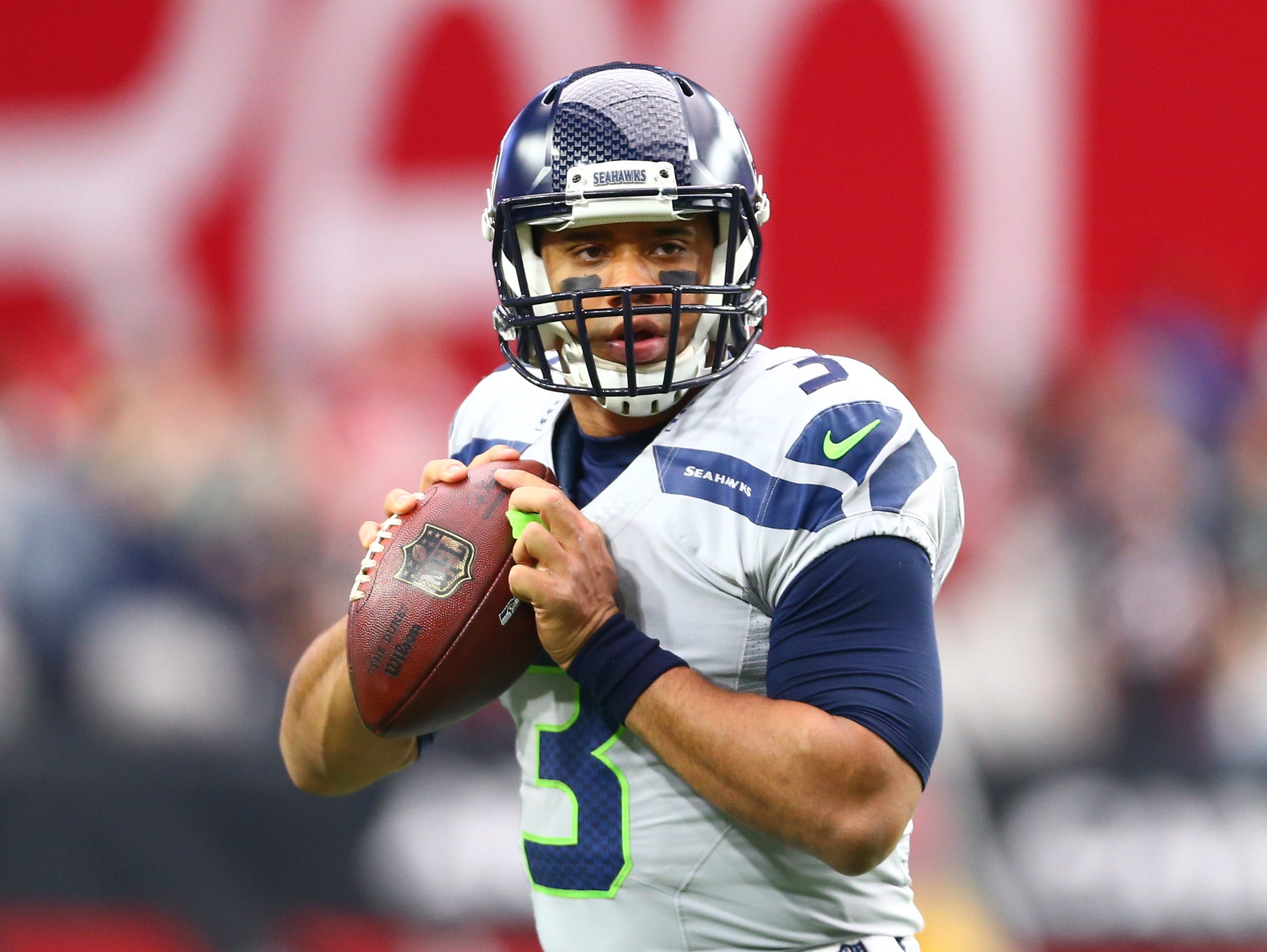 Jan 3, 2016; Glendale, AZ, USA; Seattle Seahawks quarterback Russell Wilson warms up prior to the game against the Arizona Cardinals at University of Phoenix Stadium. Mandatory Credit: Mark J. Rebilas-USA TODAY Sports ORG XMIT: USATSI-224956 ORIG FIL