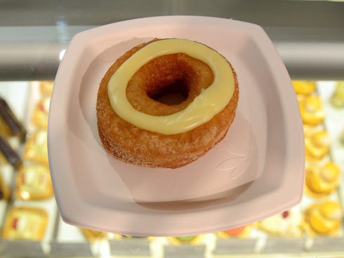 A cronut, a unique croissant-doughnut sold at Ansel's bakery shop in New York City, is one of several food fads that are worth a trip to try.