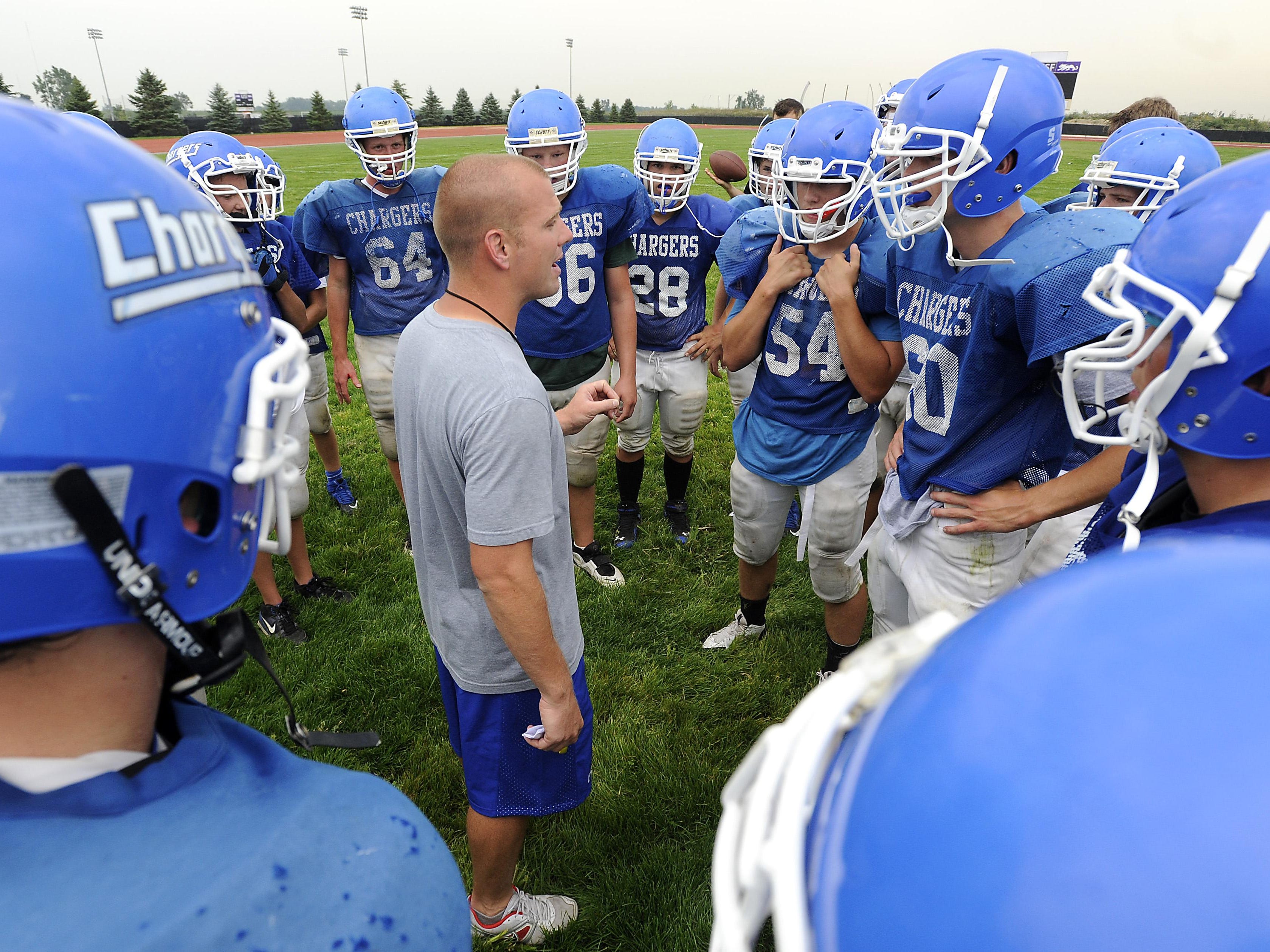 Sioux Falls Christian coach Jake Pettengill talks with his team during practice in 2013. The Chargers will face Bridgewater-Emery/Ethan on Friday.