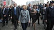 Secretary of State Hillary Clinton smiles as she walks