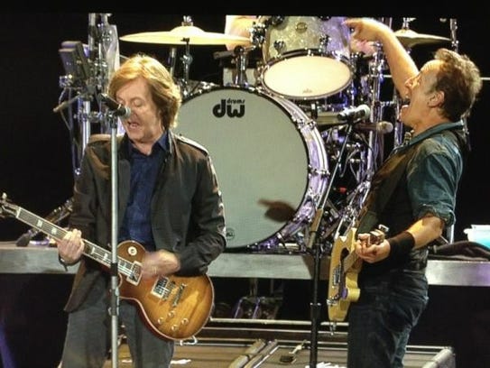 Paul McCartney (left) joins Bruce Springsteen during
