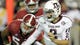 Manziel scrambles out of the pocket under pressure from the Alabama defense during the fourth quarter at Bryant Denny Stadium.