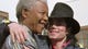 Michael Jackson hugs Mandela at the conclusion of a brief meeting on July 20, 1996.
