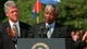 President Clinton listens as Mandela speaks on Oct. 4, 1994, during an arrival ceremony at the White House.