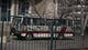 A bus is covered in camouflage netting in a parking lot of a building in Pyongyang on March 9.