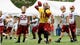 Washington Redskins quarterback Robert Griffin III (10) throws the ball during opening day of training camp at the Bon Secours Washington Redskins Training Center.