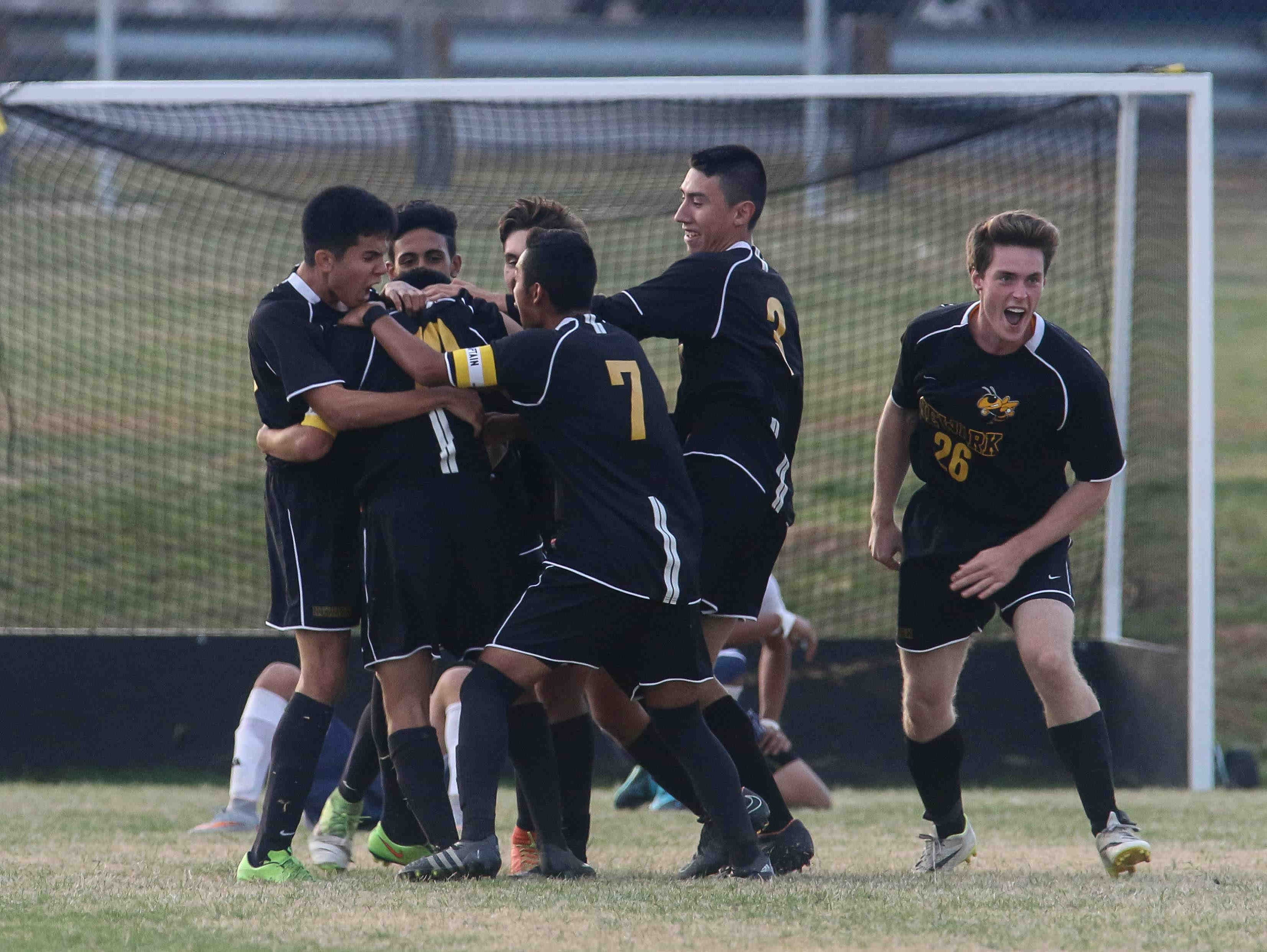 Newark FC Forward Diego Guzman (10) celebrates with his teammate after scoring the winning goal against Delcastle on Thursday.