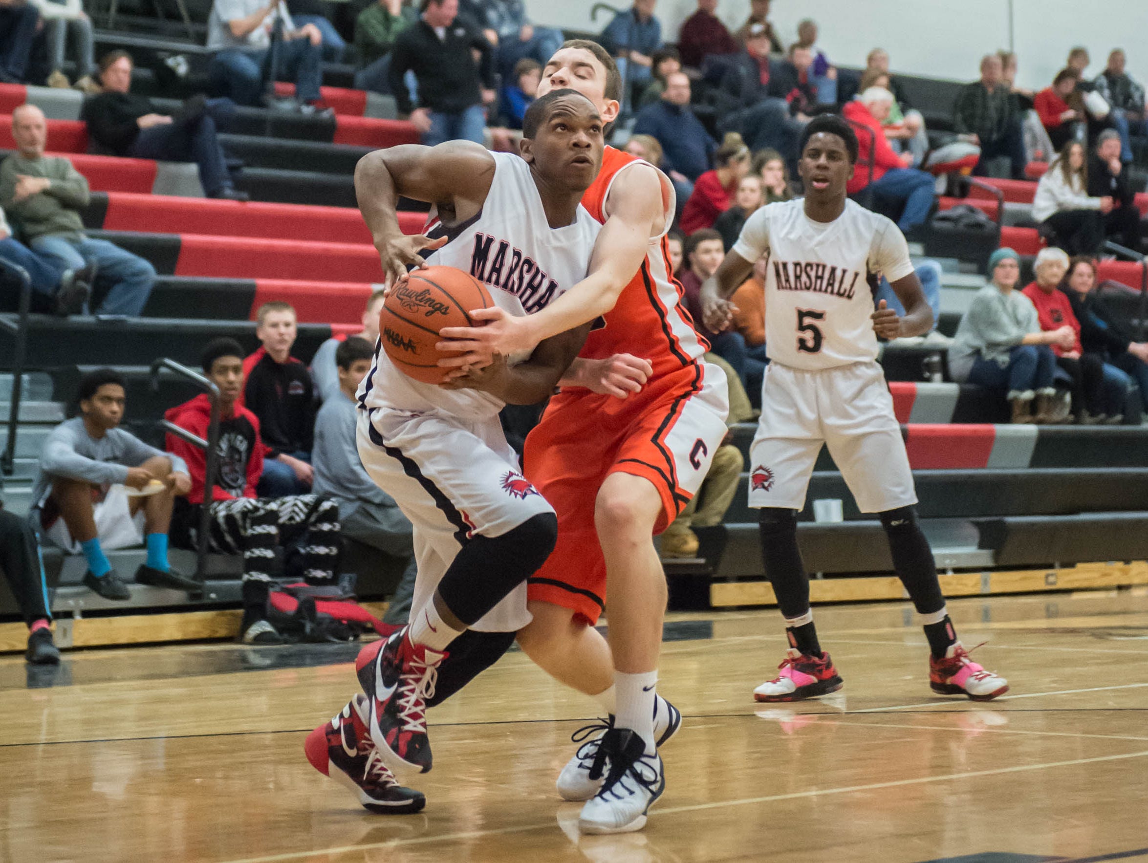 Marshall's Forrest Jackson drives to the hoop against Chatlotte in Tuesday evening's game.