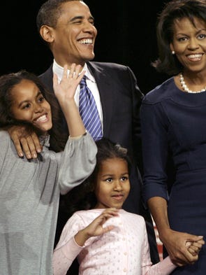 Then-presidential hopeful Barack Obama waves to supporters