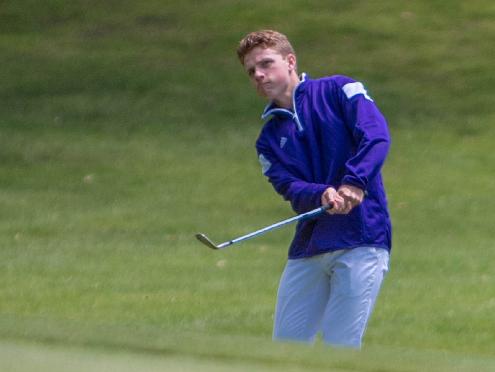 Lakeview junior James Staab chips to the green during All-City Golf Tournament at Riverside Golf Club on Friday.