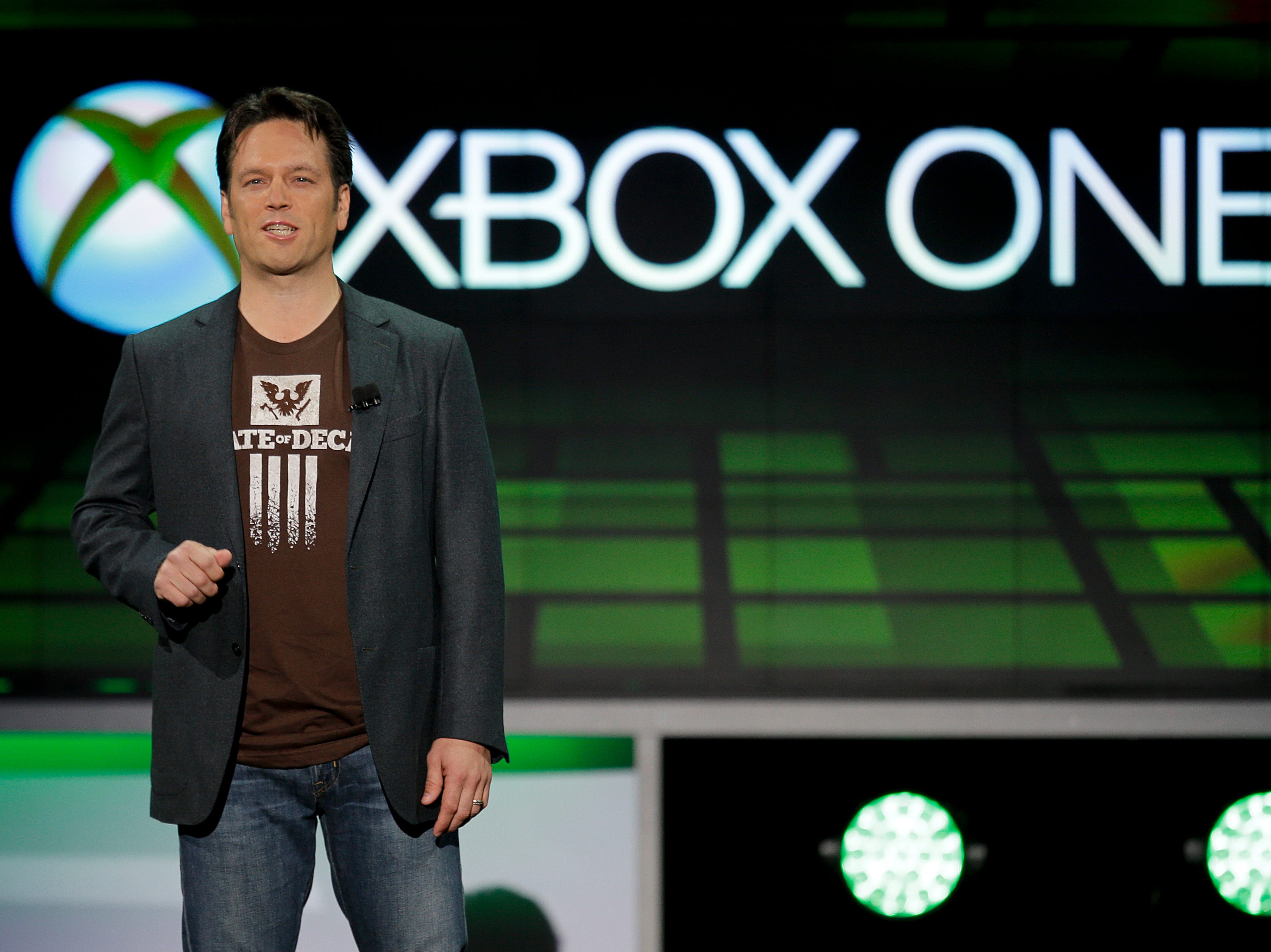 In this June 10, 2013 file photo, Phil Spencer of Microsoft Game Studios speaks at the Microsoft Xbox E3 media briefing in Los Angeles.