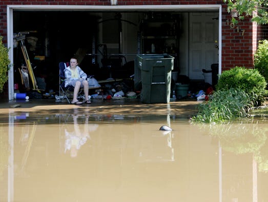 Samantha Smith, 15, sits in the garage of her home