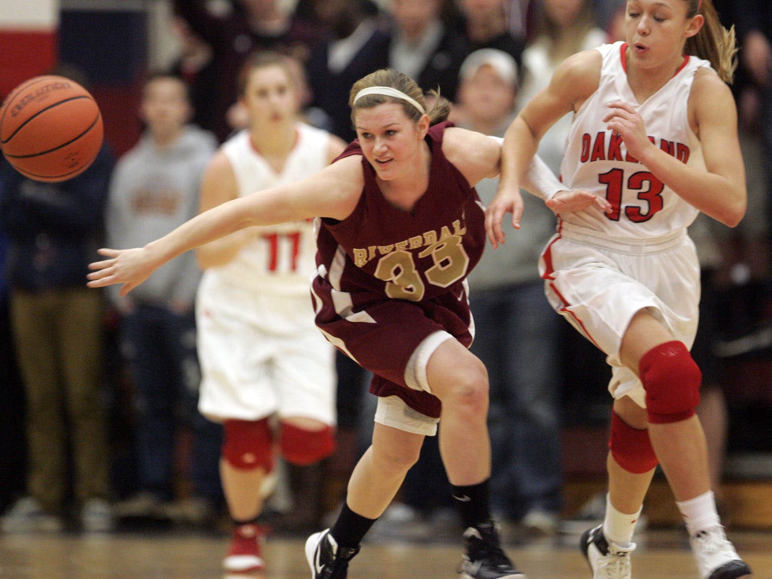 John A. Gillis/DNJ Riverdale's Alexa Middleton, left, and Oakland's Emily Eubank chase the ball in the first half at Oakland Friday, Jan. 28, 2012.