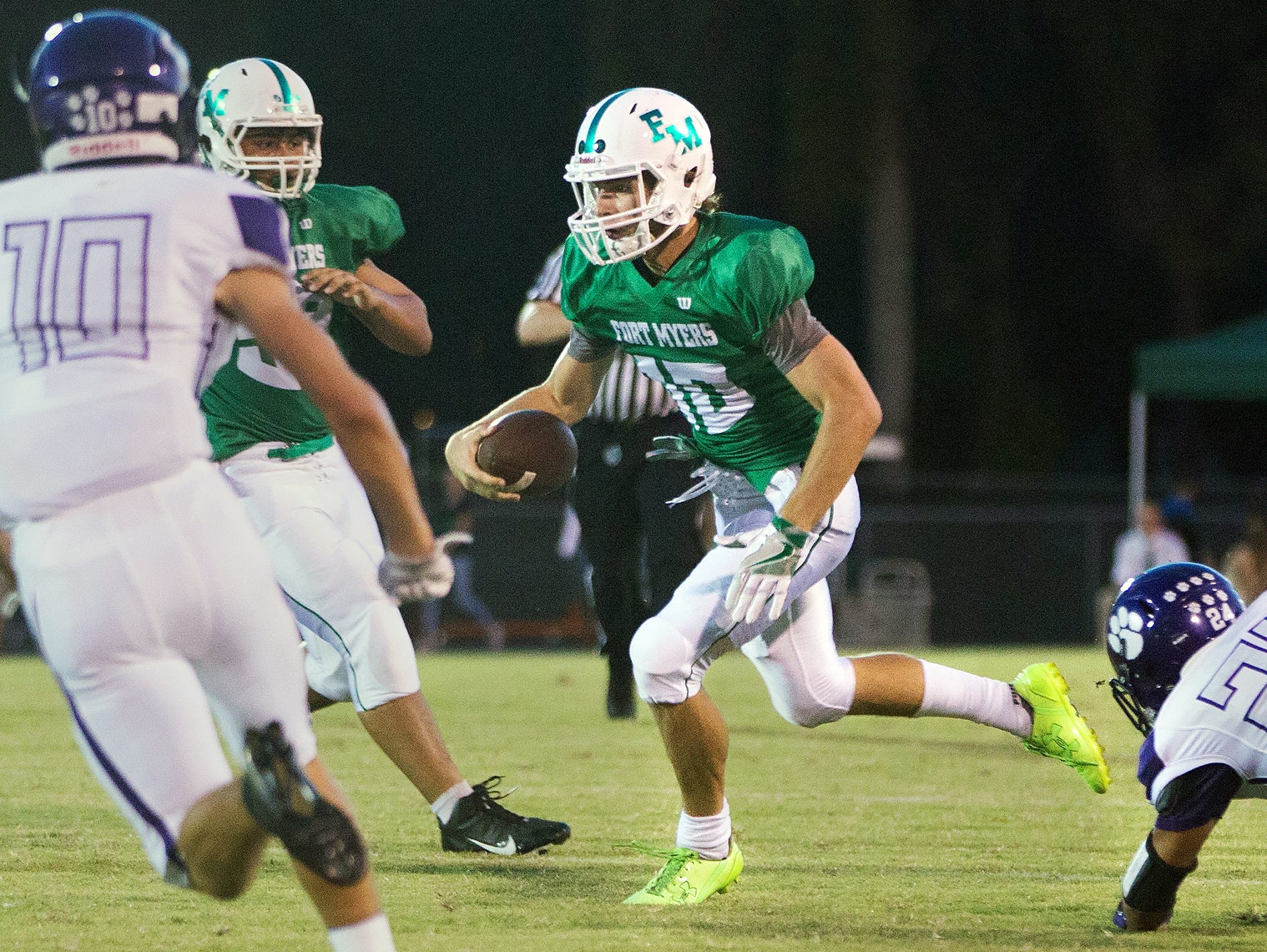 Fort Myers High School's Ben Stobaugh picks up a first down against Cypress Lake recently at Fort Myers High School.