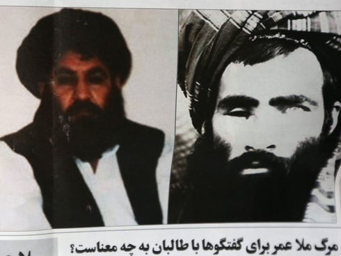 An Afghan newspaper headlines pictures of the new leader of the Afghan Taliban, Mullah Akhtar Mohammad Mansoor, left, and Mullah Mohammad Omar, in Kabul, Afghanistan,
