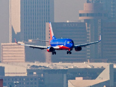 A Southwest Airlines jet lands at Phoenix Sky Harbor Airport on Dec. 5, 2007.