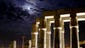 A full moon is seen over the ruins of Luxor Temple