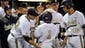 Teammates congratulate Vanderbilt designated hitter