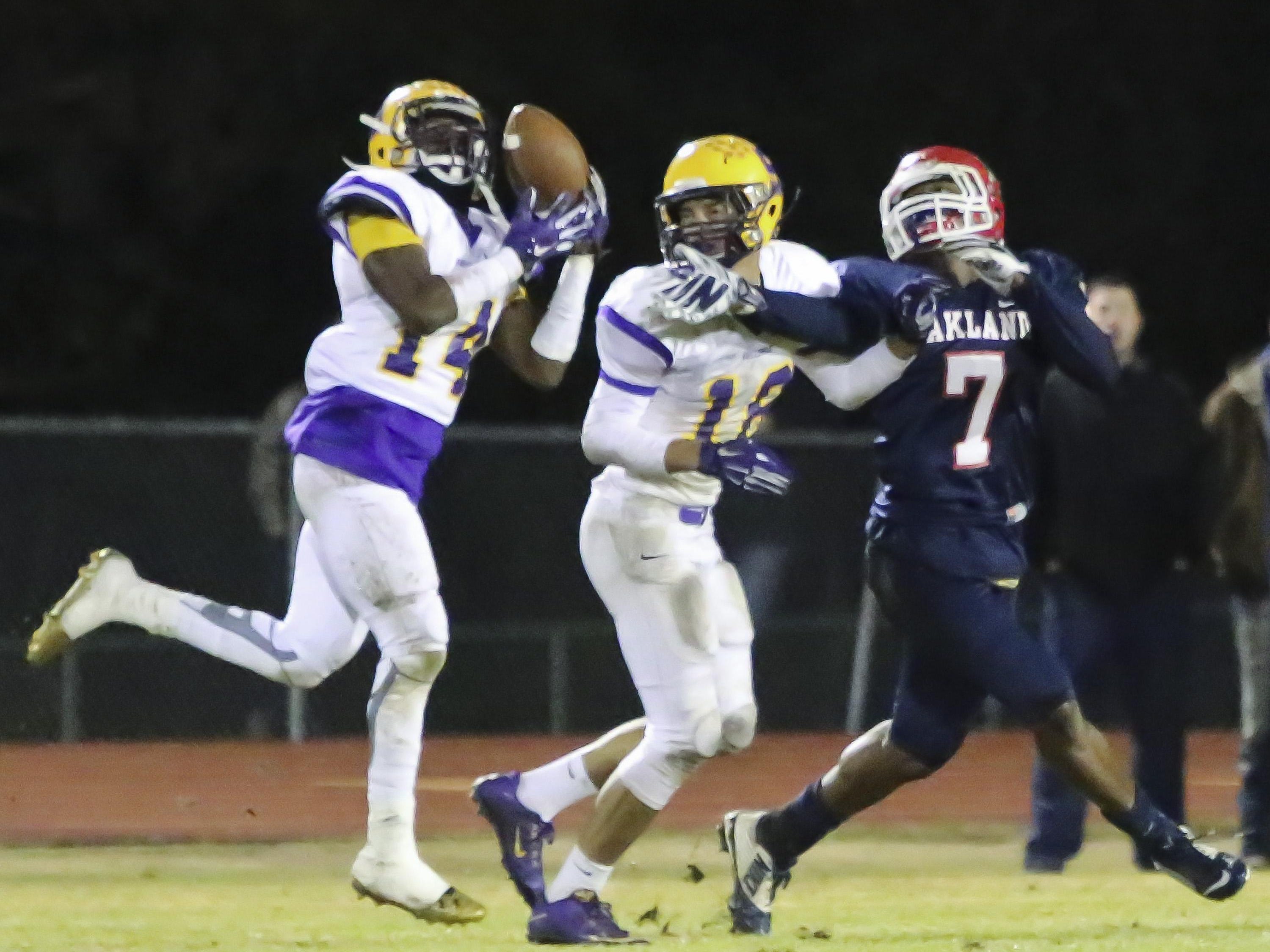 #14 Jordan Jones intercepts an Oakland pass intended for #7 JaCoby Stevens