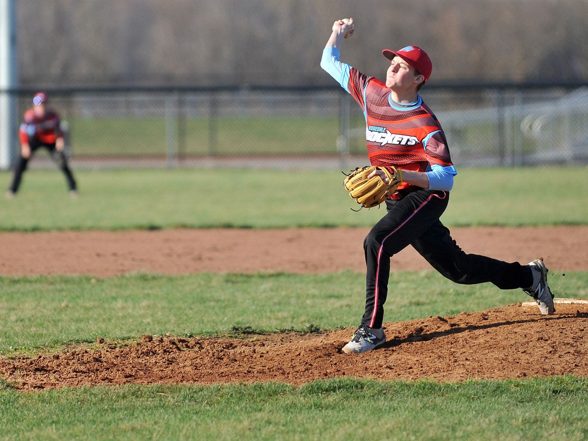 Ridgedale junior pitcher Monroe Britton delivers a strike during a Friday evening game at Crestline High School.