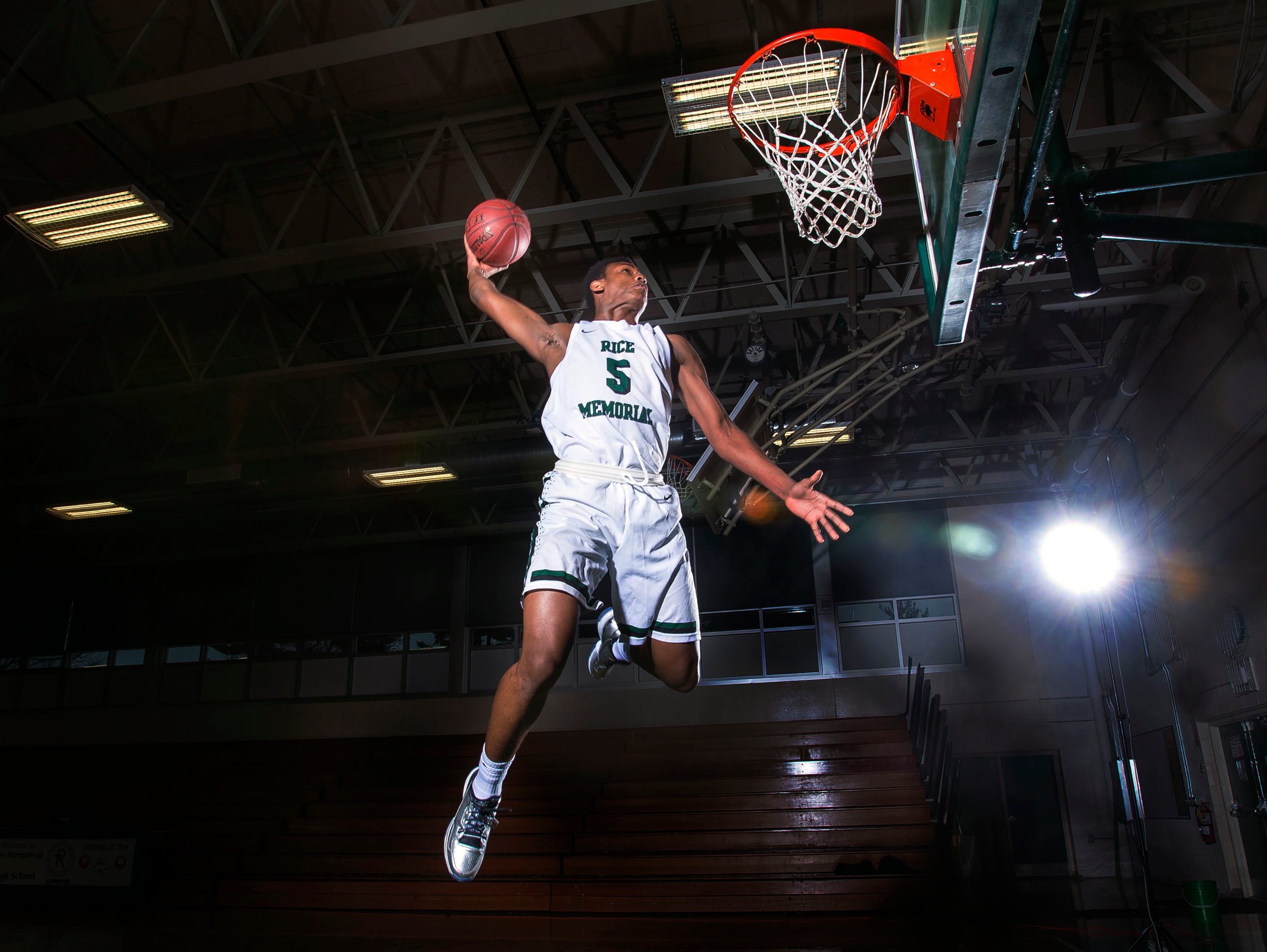 Kendrick Gray of Rice Memorial High School dunks the ball in South Burlington on Monday, April 27, 2015.