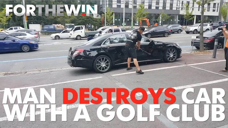 Man destroys car with golf club