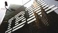 IBM falls short in revenue estimates, cuts profit forecast