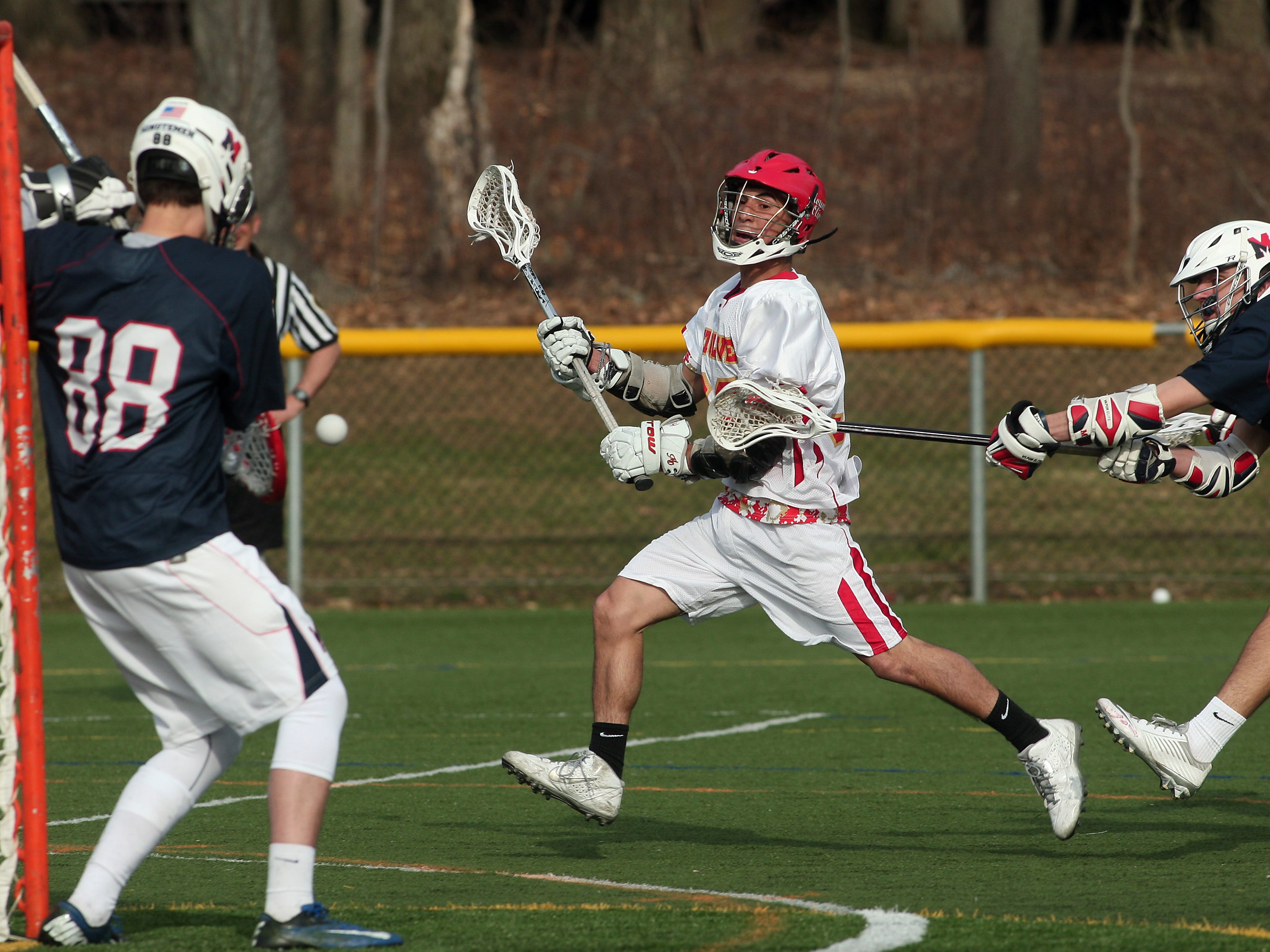Mount Olive's Adam Gonzalez shoots on goal against Mendham during their boys lacrosse matchup on Thursday at Mount Olive.