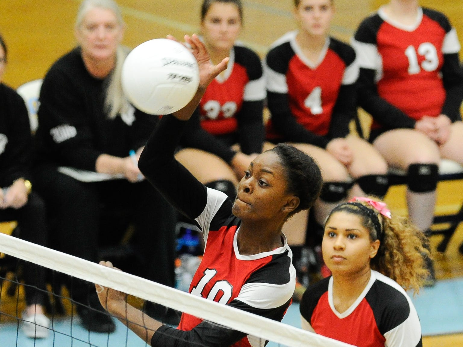 Conrad's #10 Amiya Rattley with a spike in the first game against Cape Thursday night at Cape Henlopen High School.