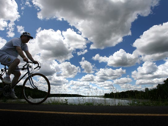 A biker rides through the trails at Stony Creek Metropark