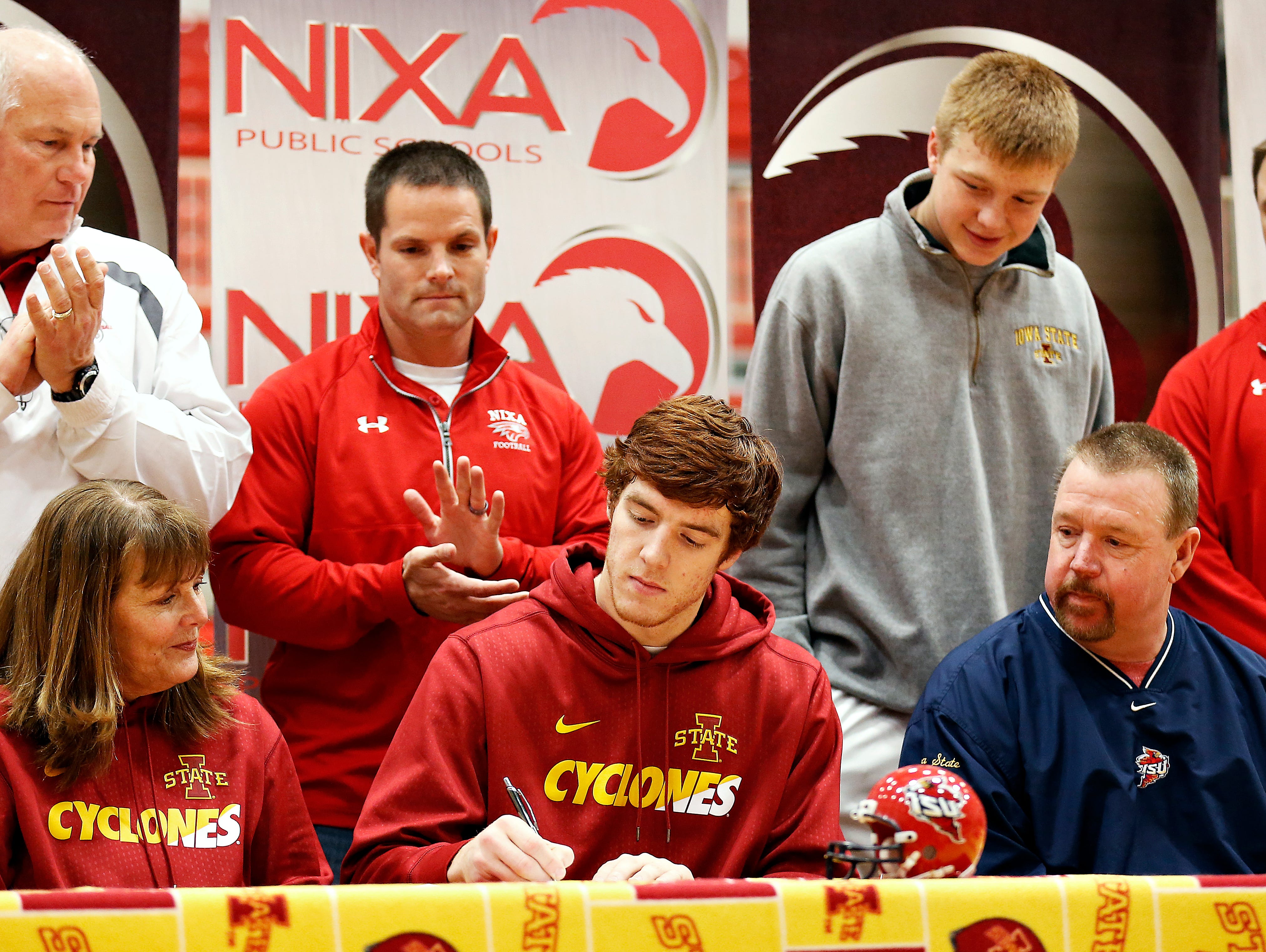 Nixa High School senior Chase Allen signs a national letter of intent to play football at Iowa State University at the Nixa High School gym in Nixa, Mo. on Feb. 3, 2016.