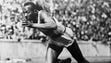 Jesse Owens competes in a preliminary heat of the 200-meter
