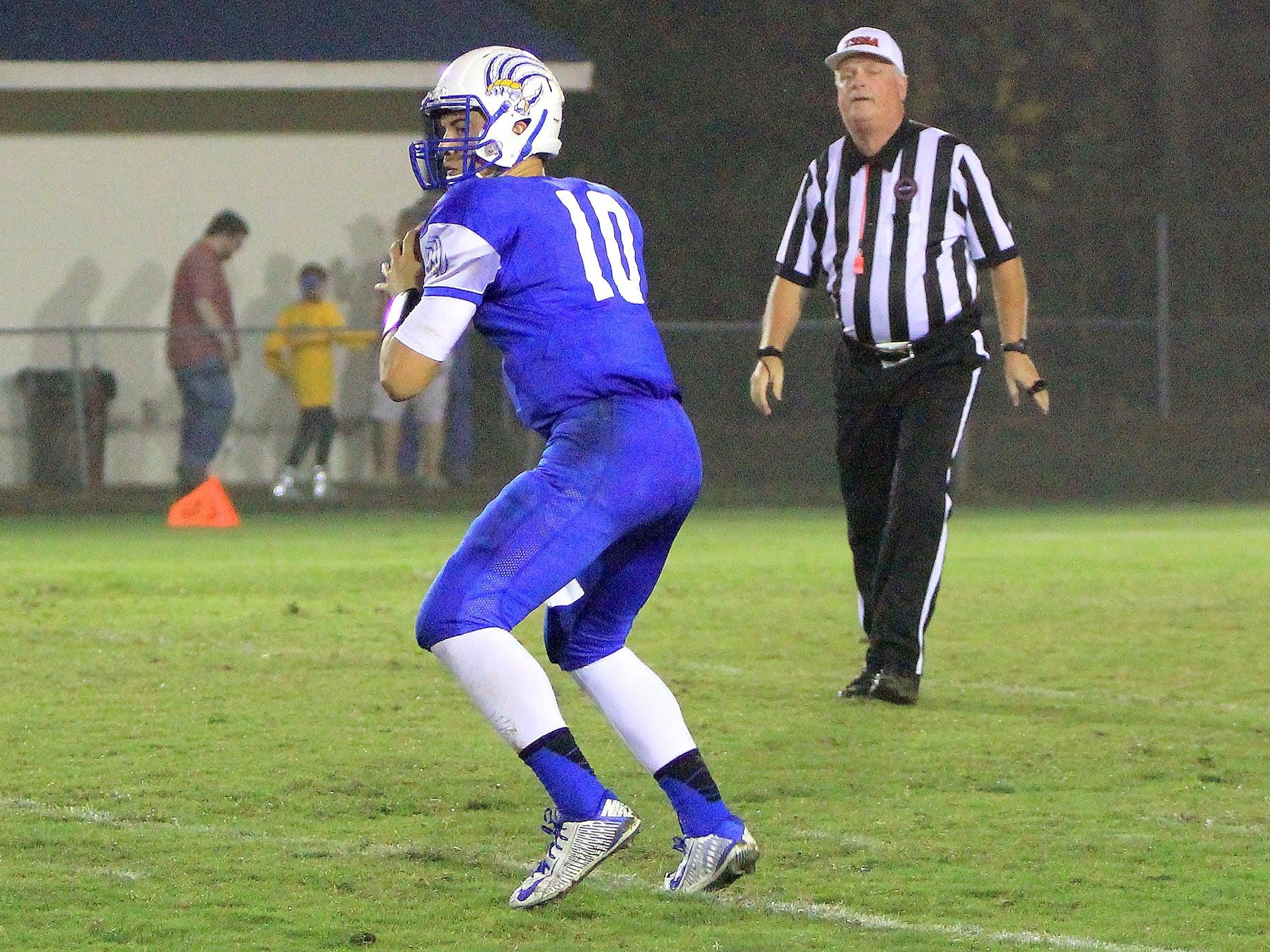 Drake Smith looks to pass during a 28-14 win over McNairy last season.