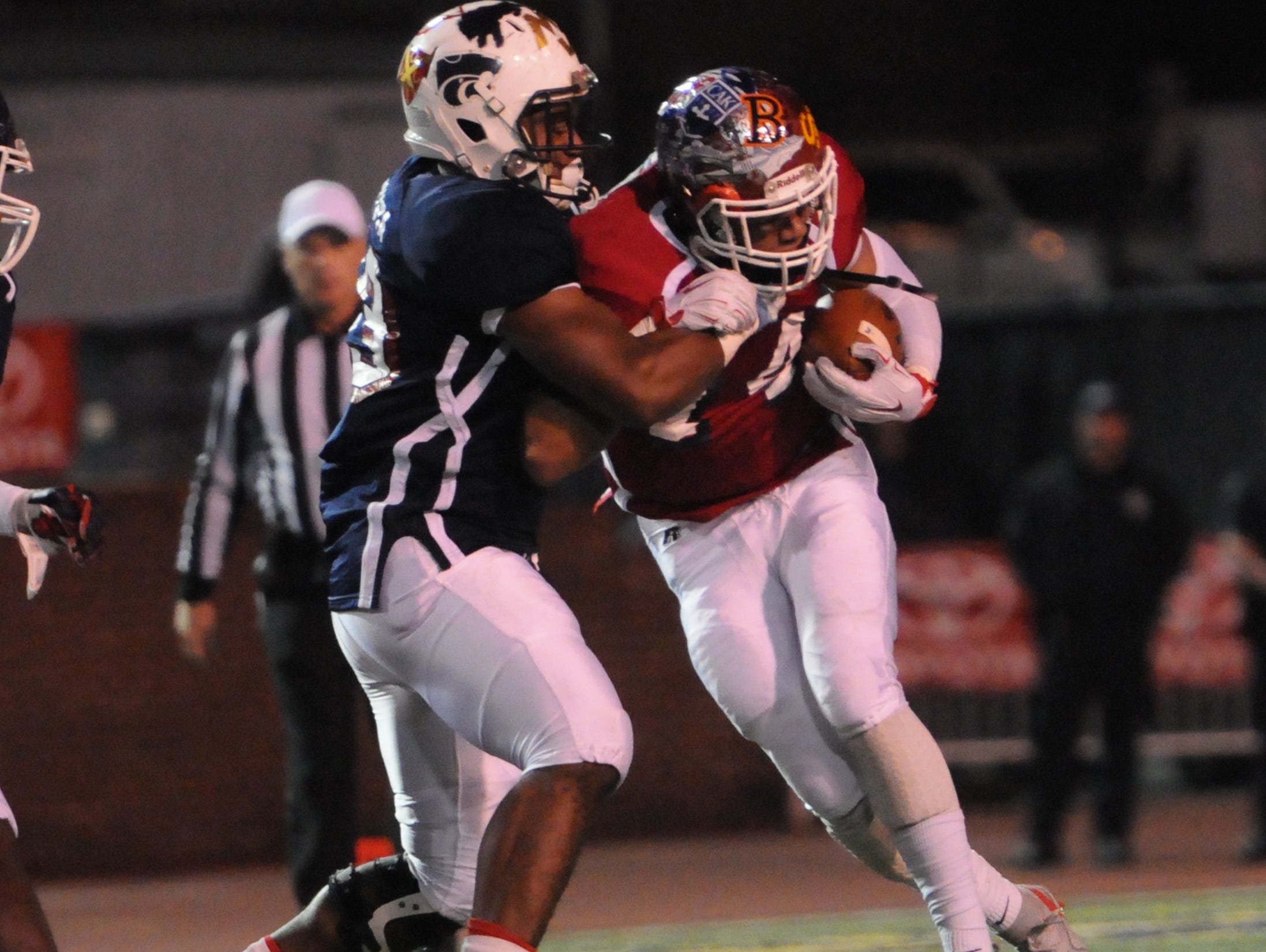 Centennial's Tyrel Dodson tackles East opponent DeAndre Delaney during Friday's East-West All-Star game in Cookeville.