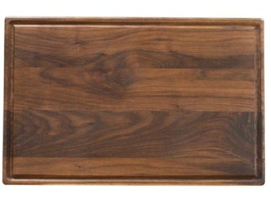 The Virgina Boys Kitchens walnut cutting board is unfinished,