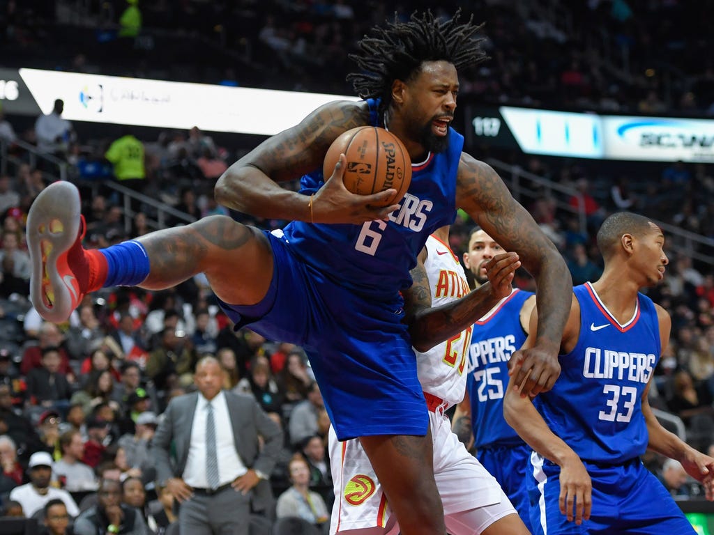LA Clippers center DeAndre Jordan controls a rebound against the Atlanta Hawks during the second half at Philips Arena. The Clippers won the game, 116-103.