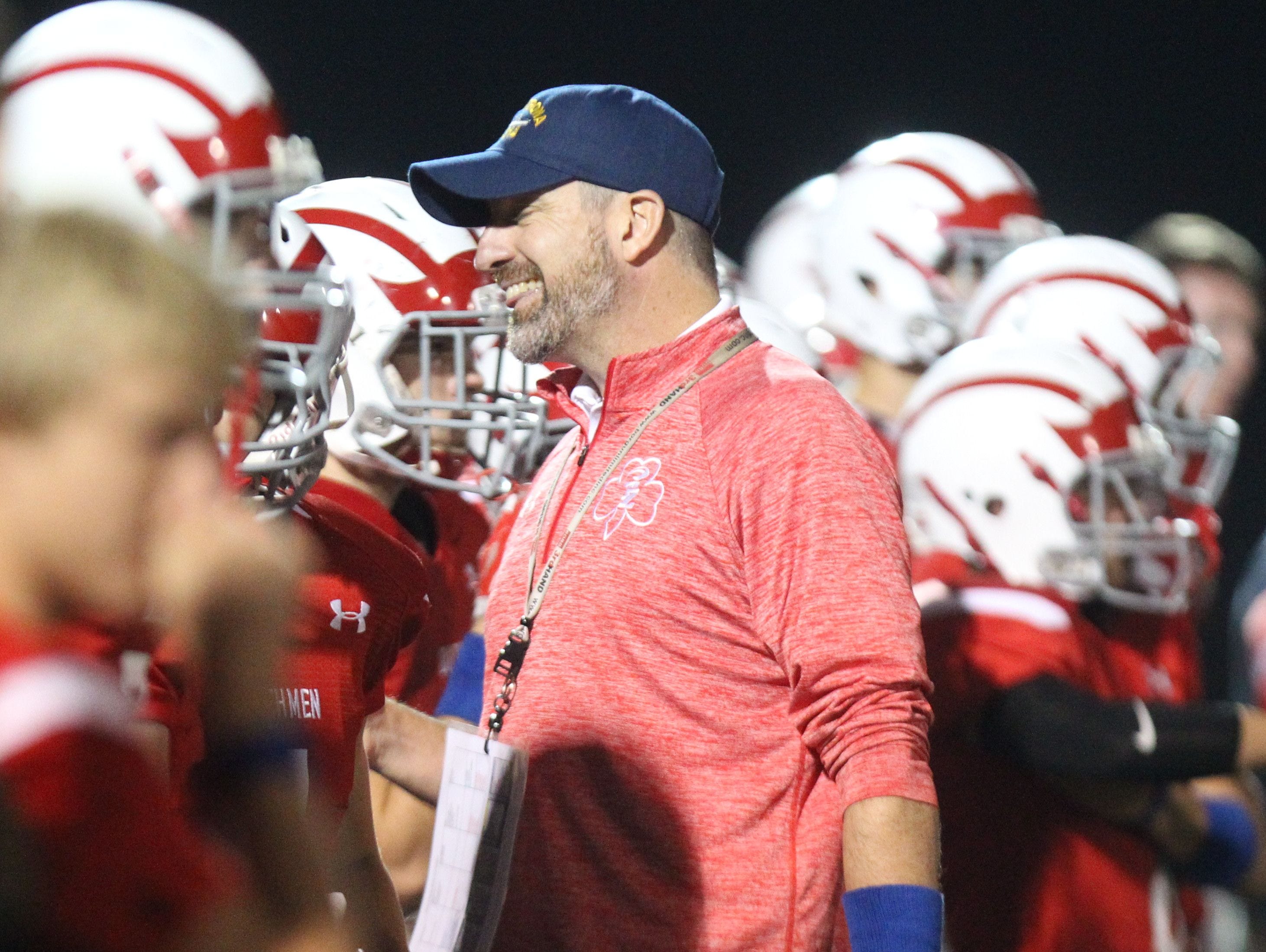 Tappan Zee football coach Andy DiDomenico smiles at his team as they beat Byram Hills 27-20 at Tappan Zee Oct. 9, 2015.