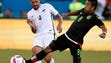 Mexico's Marco Fabian (8) takes the ball from New Zealand's