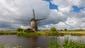 Clouds pass over a windmill in the village of Kinderdijk,