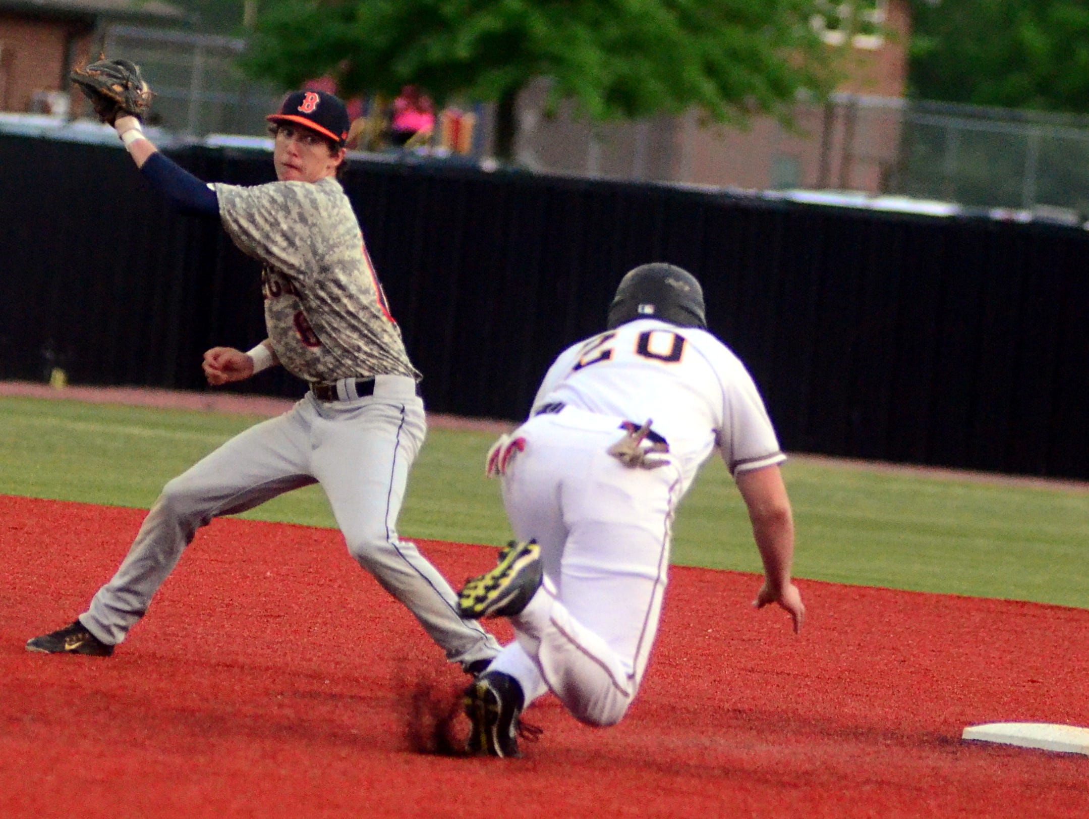 Beech High senior shortstop Tyler Maskill receives a throw as Hendersonville senior Grant Williams steals second base during first-inning action.