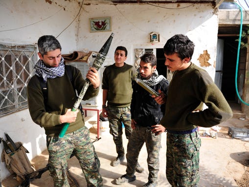 Johan Cosar inspects a rocket propelled grenade launcher