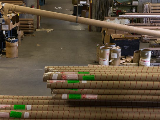 Steve Donne moves a section of a 50-foot flagpole May