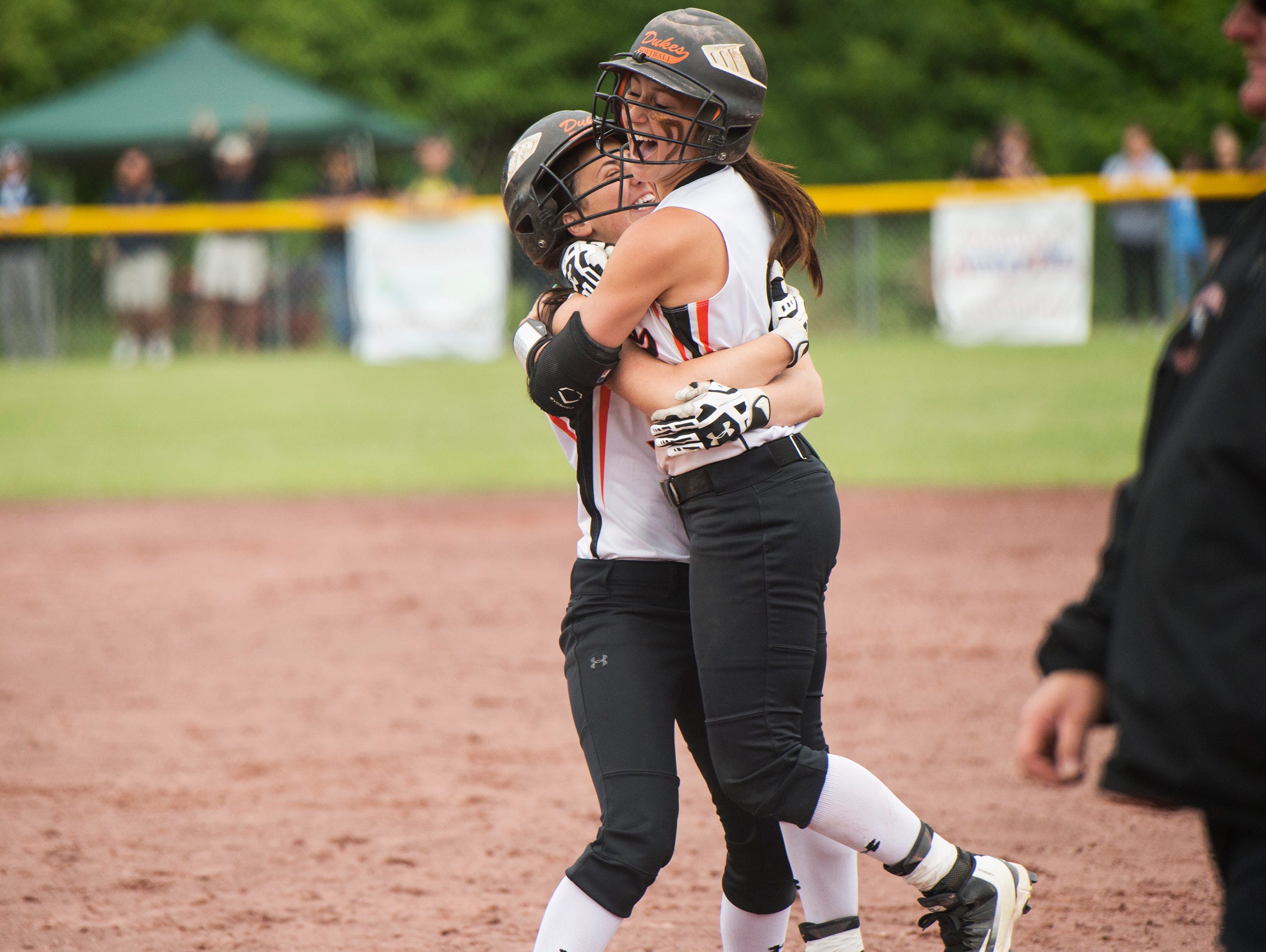 Marlboro High School's Taylor Felicello, left, hugs Ashley Votta after Votta hit the game-winning single in the bottom of the seventh inning in the Class B state title game against Windsor on Sunda in South Glens Falls.