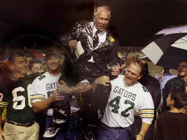 Former Captain Shreve football players Randy Maffett (left) and Mark Magner (right) carry their former football coach Lee Hedges off the field following a 2010 ceremony that dedicated Caddo Parish Stadium to the former coach. Maffett and Magner, who traveled from Houston for the event said they owed a lot to their old coach. "He taught us a commitment to excellence in everything we do," said Maffett.