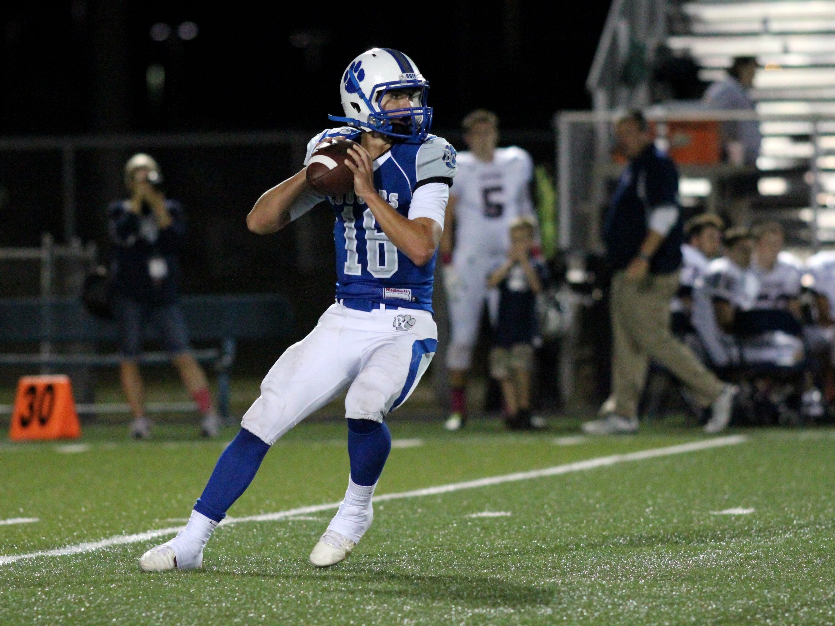 Barron Collier Jack Bueltel looks for an open receiver during Thursday night’s game against Estero.